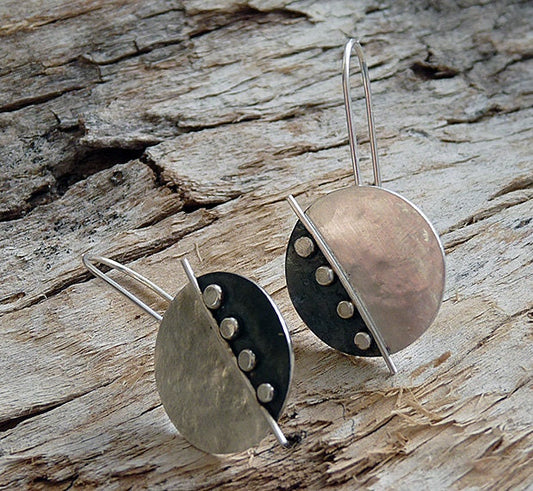 Large sterling silver disc earrings.