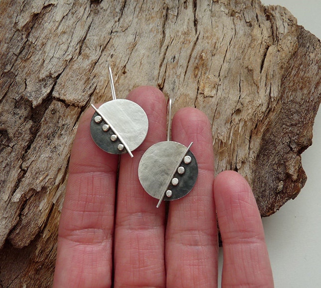 Large sterling silver disc earrings.