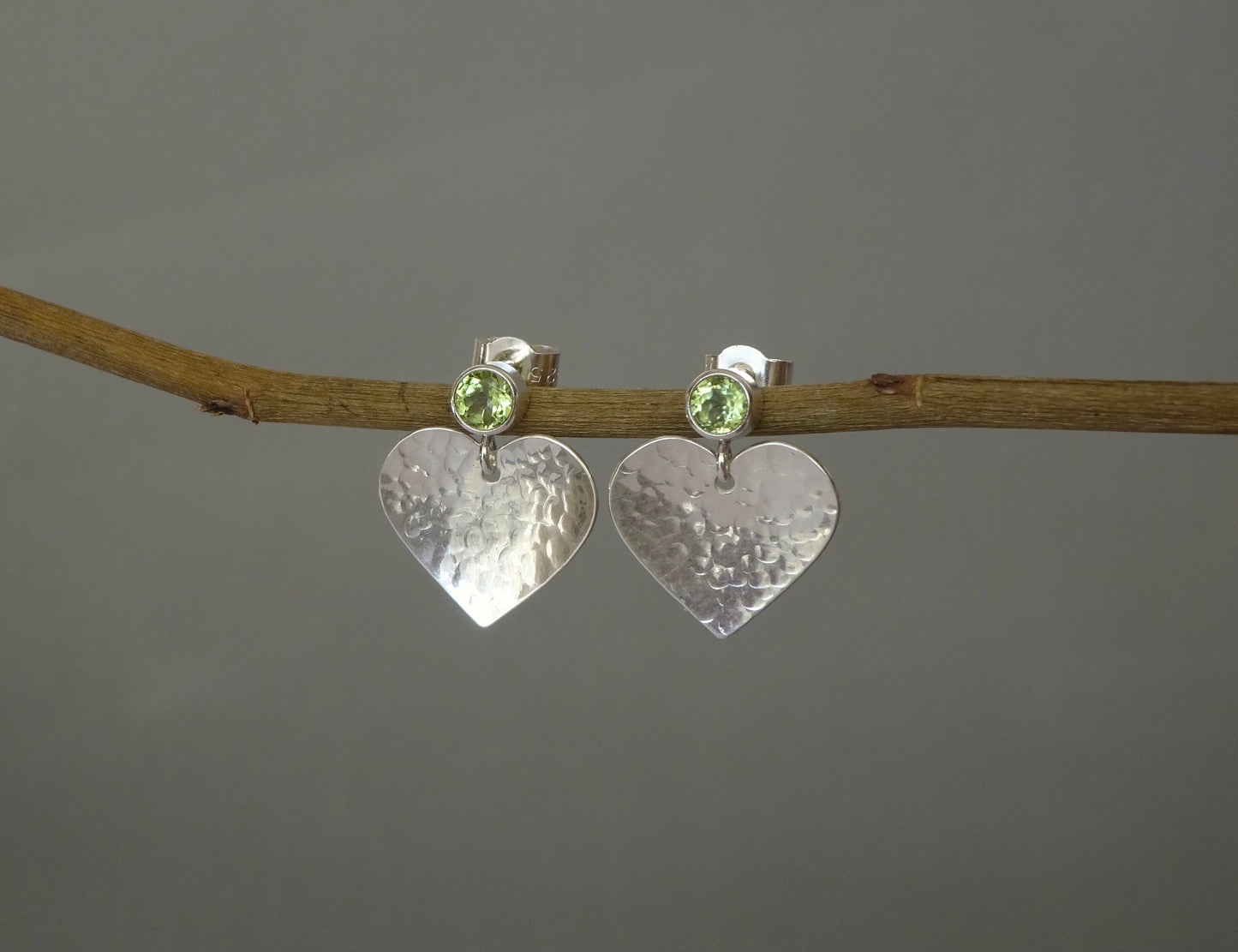 Peridot August birthstone sterling silver heart stud earrings.