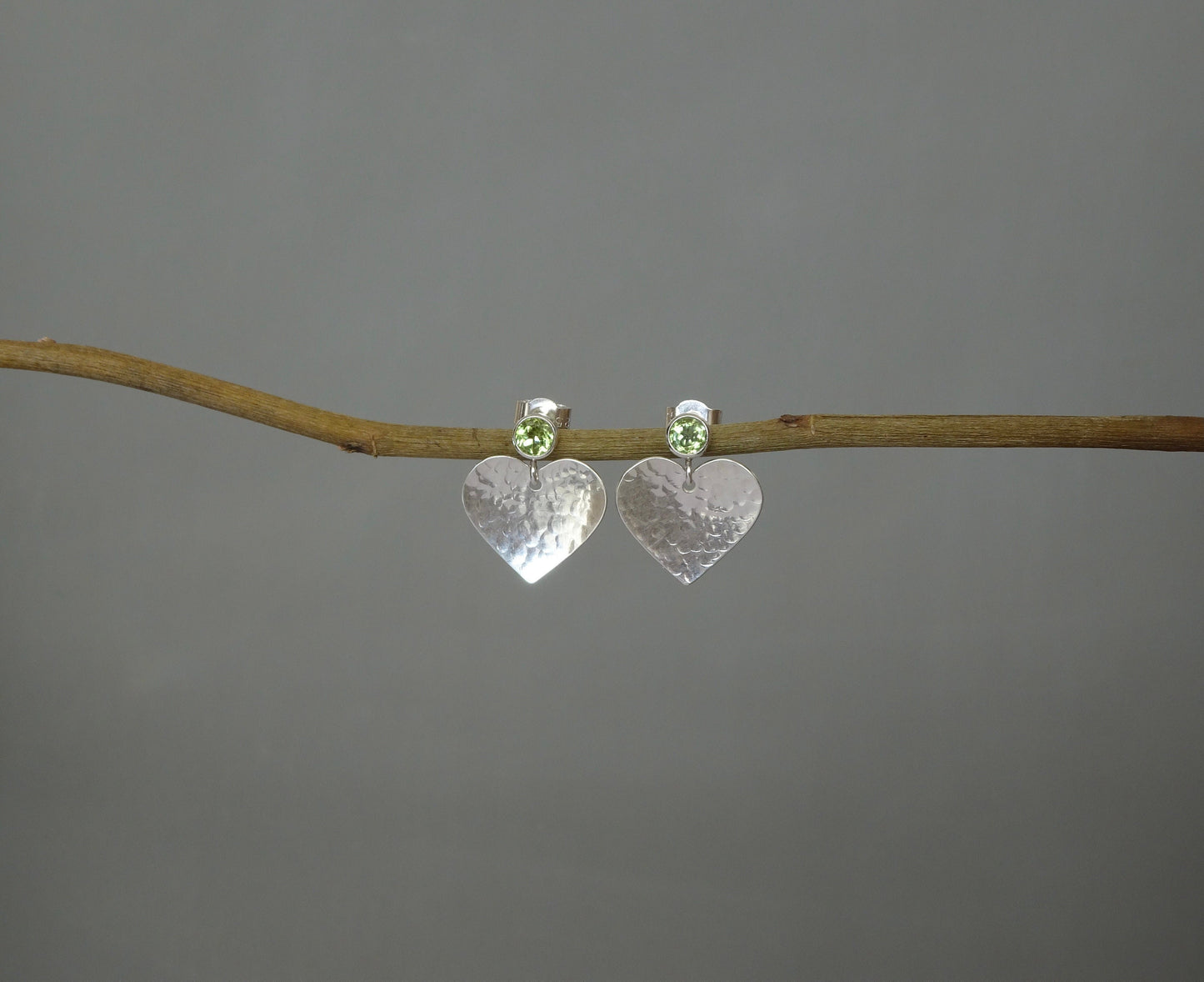 Peridot August birthstone sterling silver heart stud earrings.