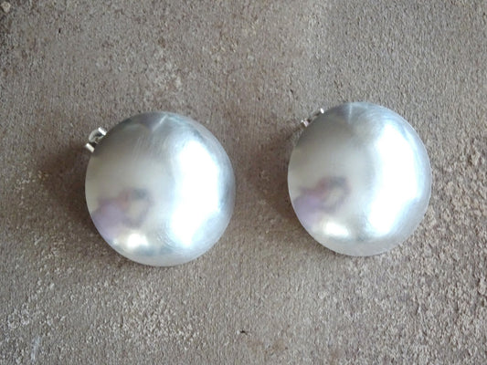 Large statement sterling silver bowl stud earrings.