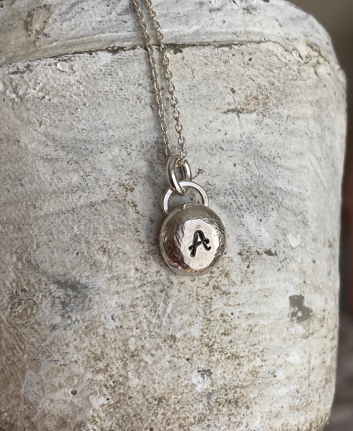 Pebble solid sterling silver personalised letter necklace.