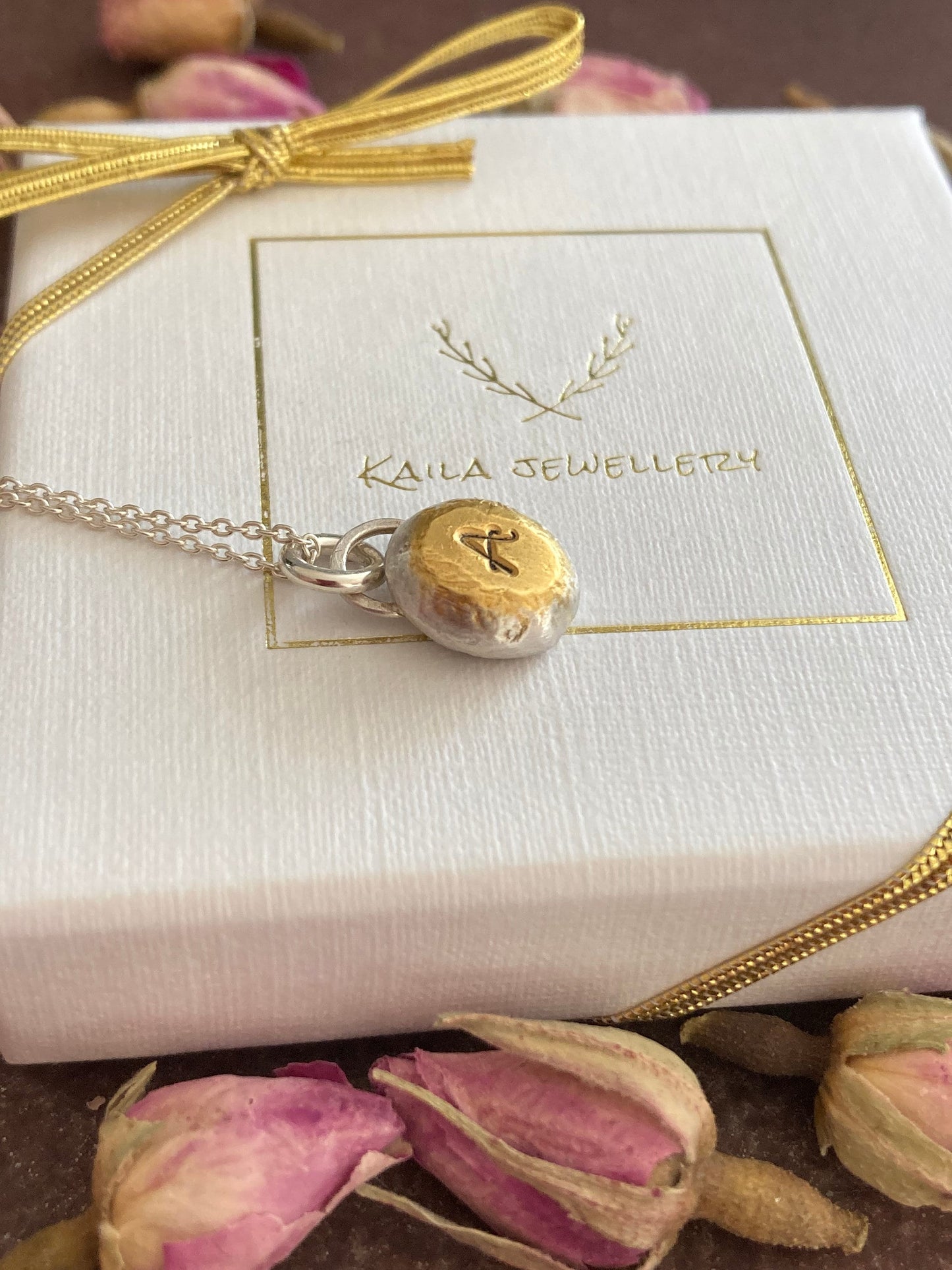 Personalised initial organic sterling silver pebble necklace.