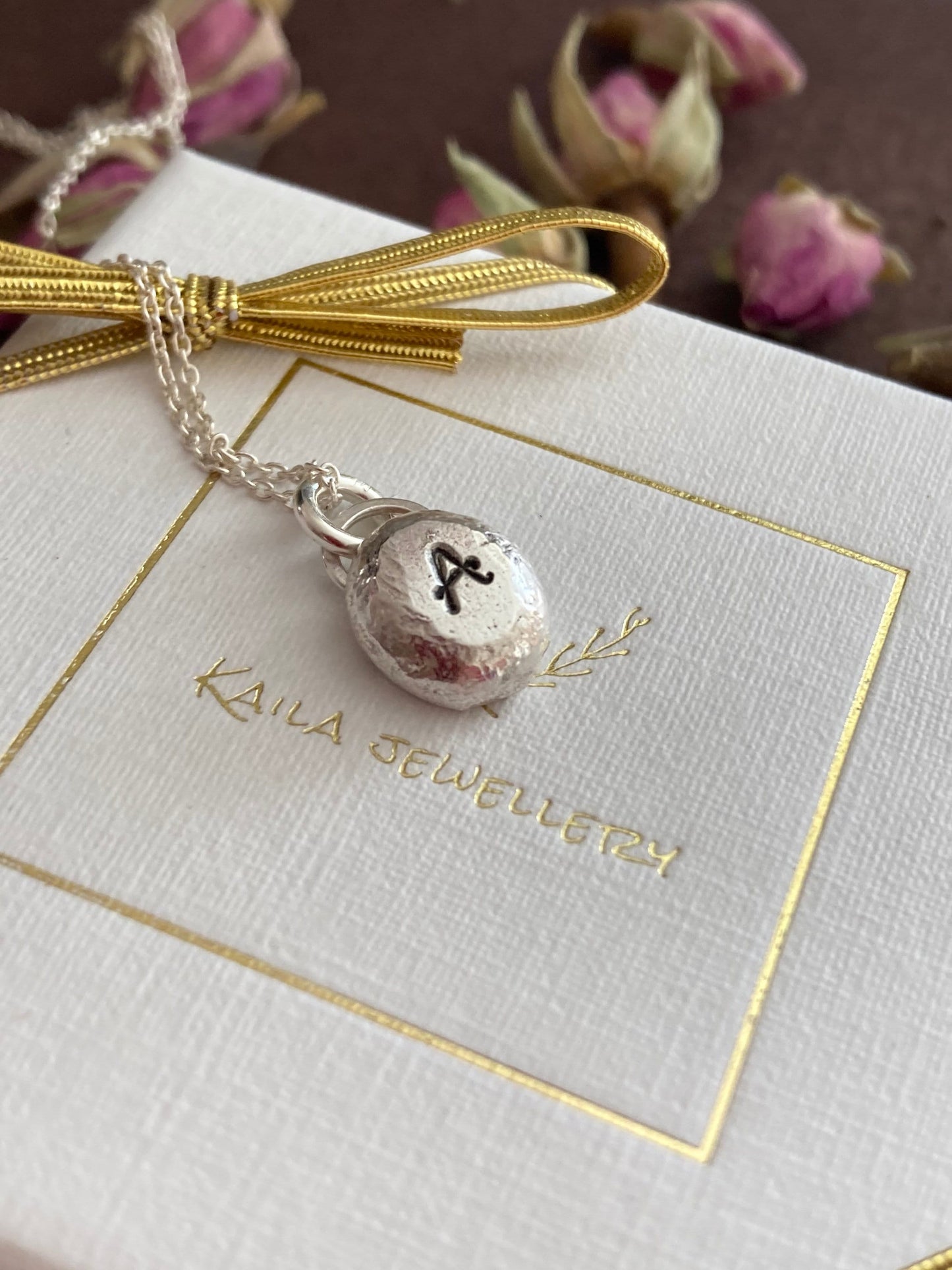 Pebble solid sterling silver personalised letter necklace.