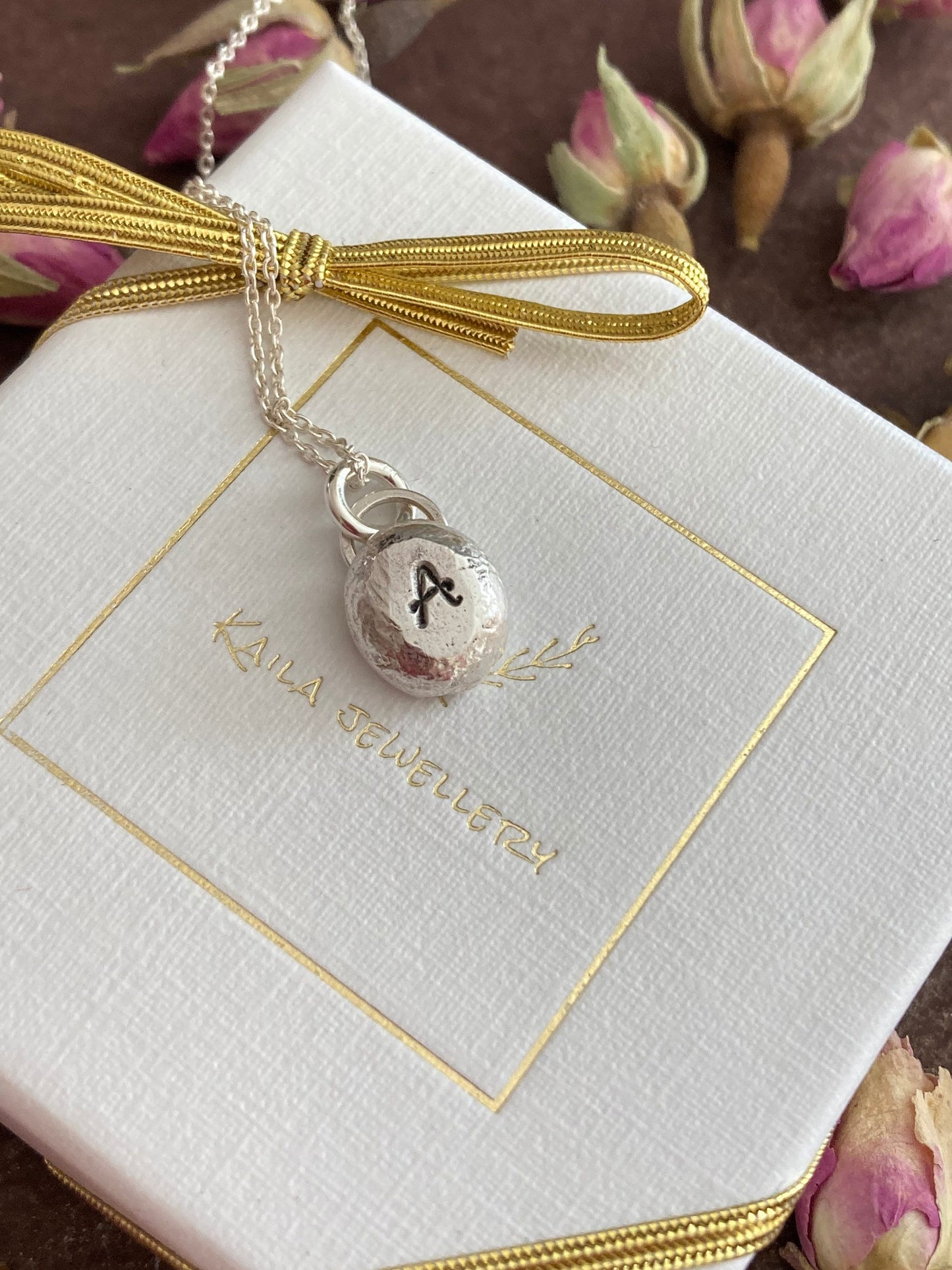 Pebble solid sterling silver personalised letter necklace.