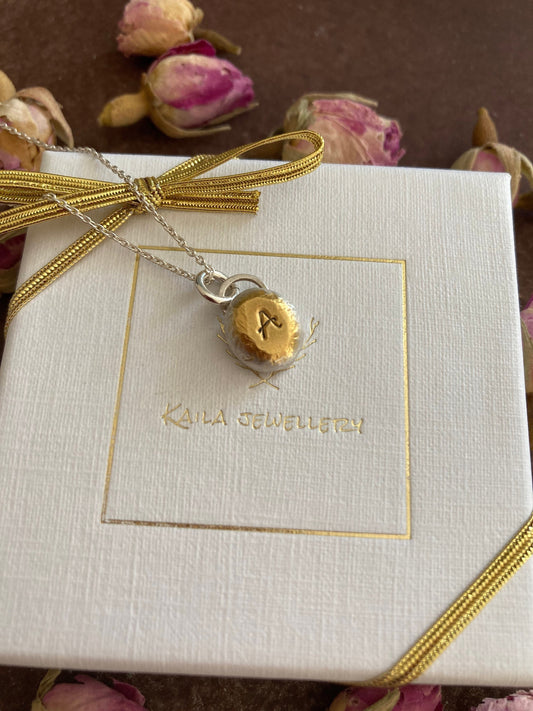 Personalised initial organic sterling silver pebble necklace.