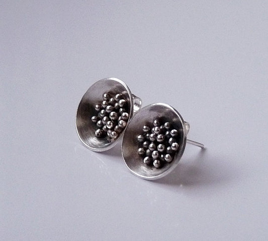 Sterling silver bowl stud earrings.