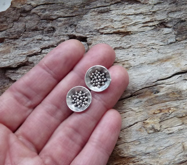 Sterling silver bowl stud earrings.