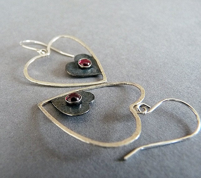 Sterling silver garnet heart earrings.