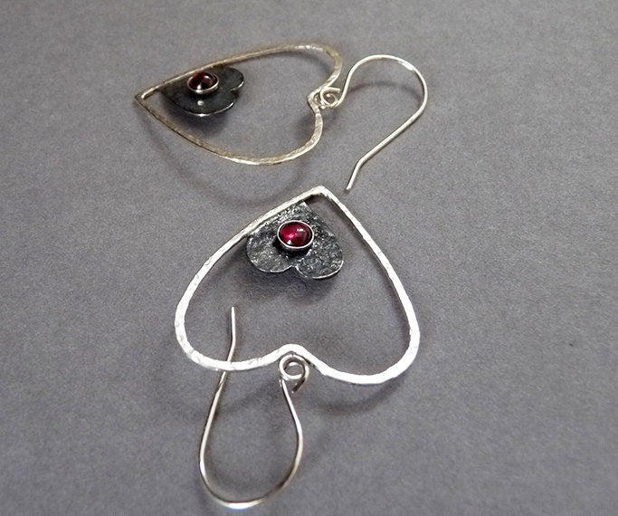 Sterling silver garnet heart earrings.