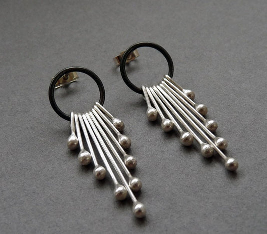 Sterling silver dangle earrings.
