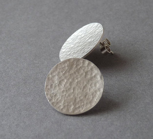 Minimalist sterling silver hammered disc stud earrings.