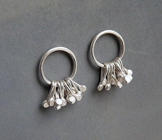Sterling silver circle and droplets stud earrings.