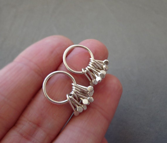 Sterling silver circle and droplets stud earrings.