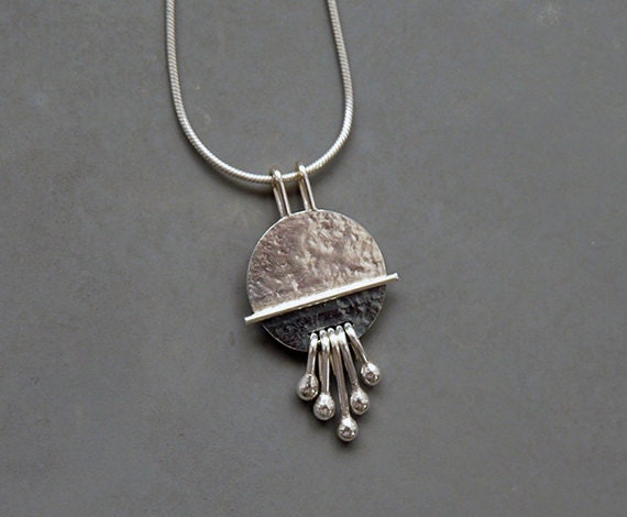 Sterling silver disc textured necklace pendant.