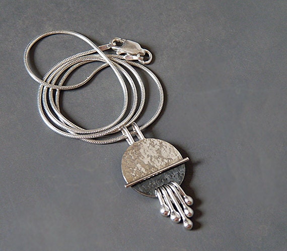Sterling silver disc textured necklace pendant.