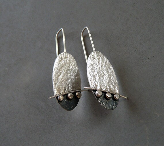 Artisan oval sterling silver drop earrings.