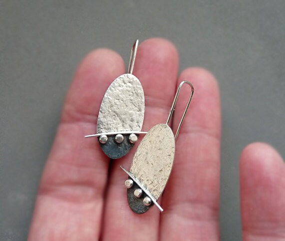 Artisan oval sterling silver drop earrings.