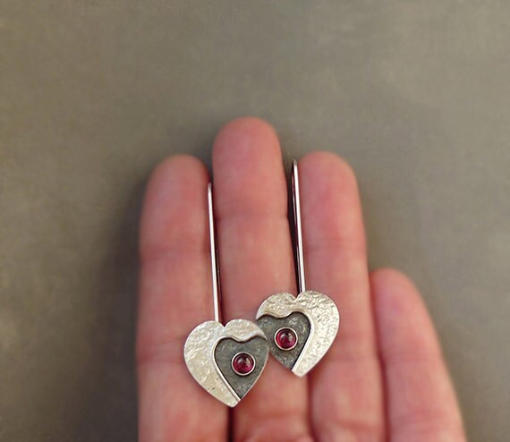 Garnet sterling silver heart earrings.