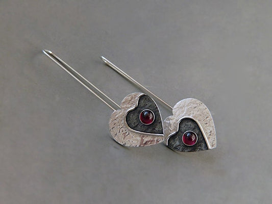 Garnet sterling silver heart earrings.