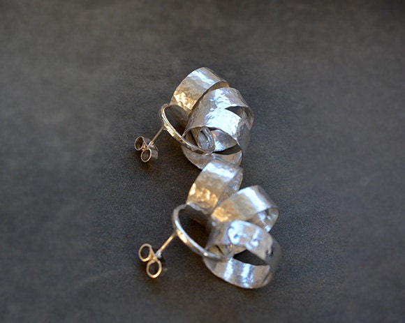 Sterling silver circle stud earrings.