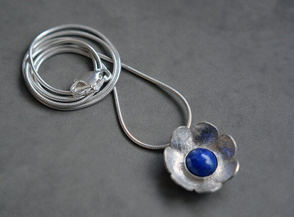 Artisan lapis lazuli flower sterling silver pendant necklace.