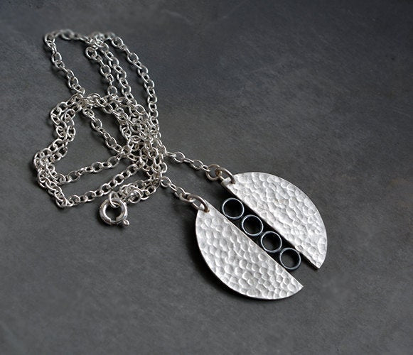 Sterling silver textured circle pendant necklace.