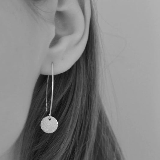Long sterling silver hammered disc earrings