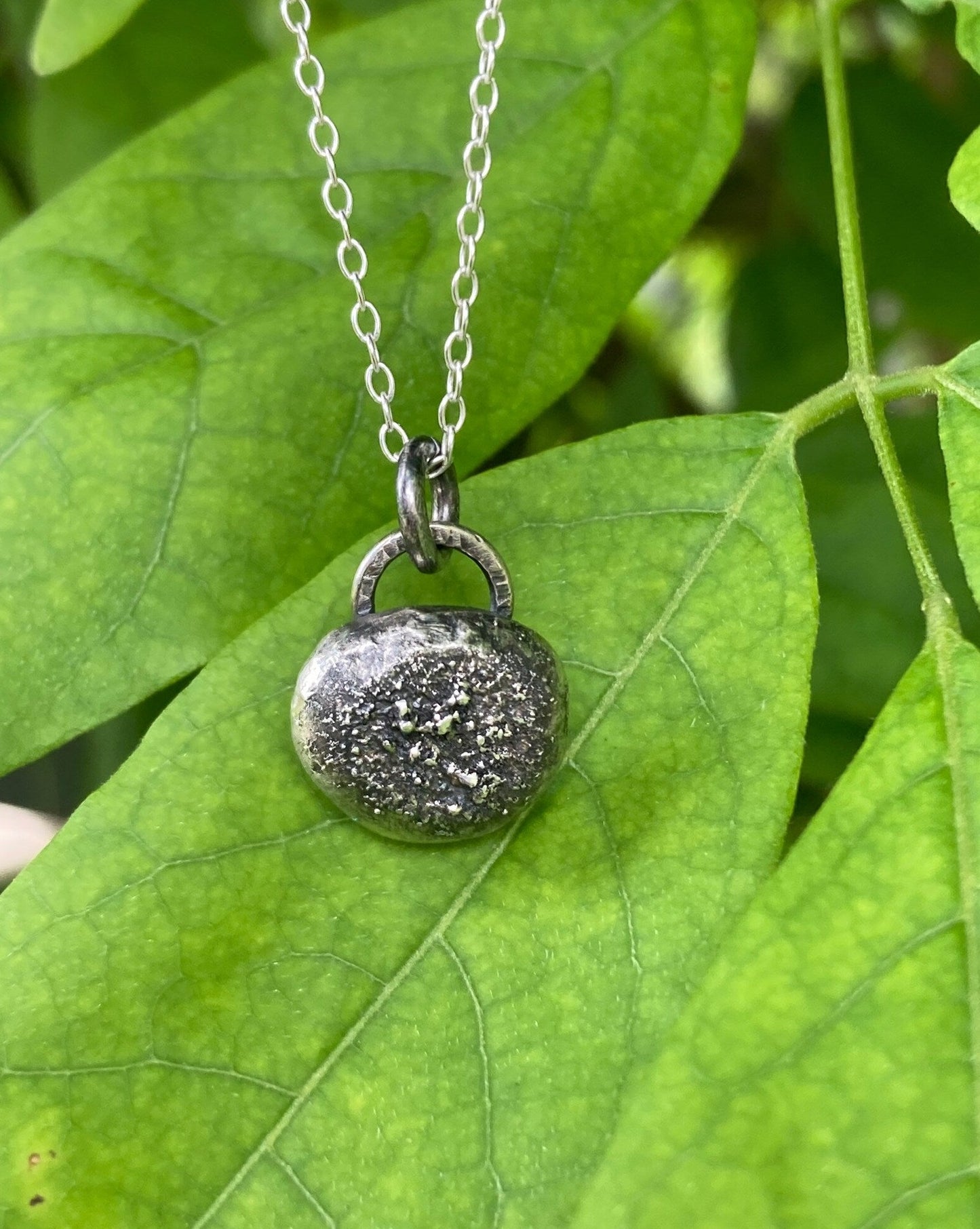 Oxidised sterling silver pebble necklace.