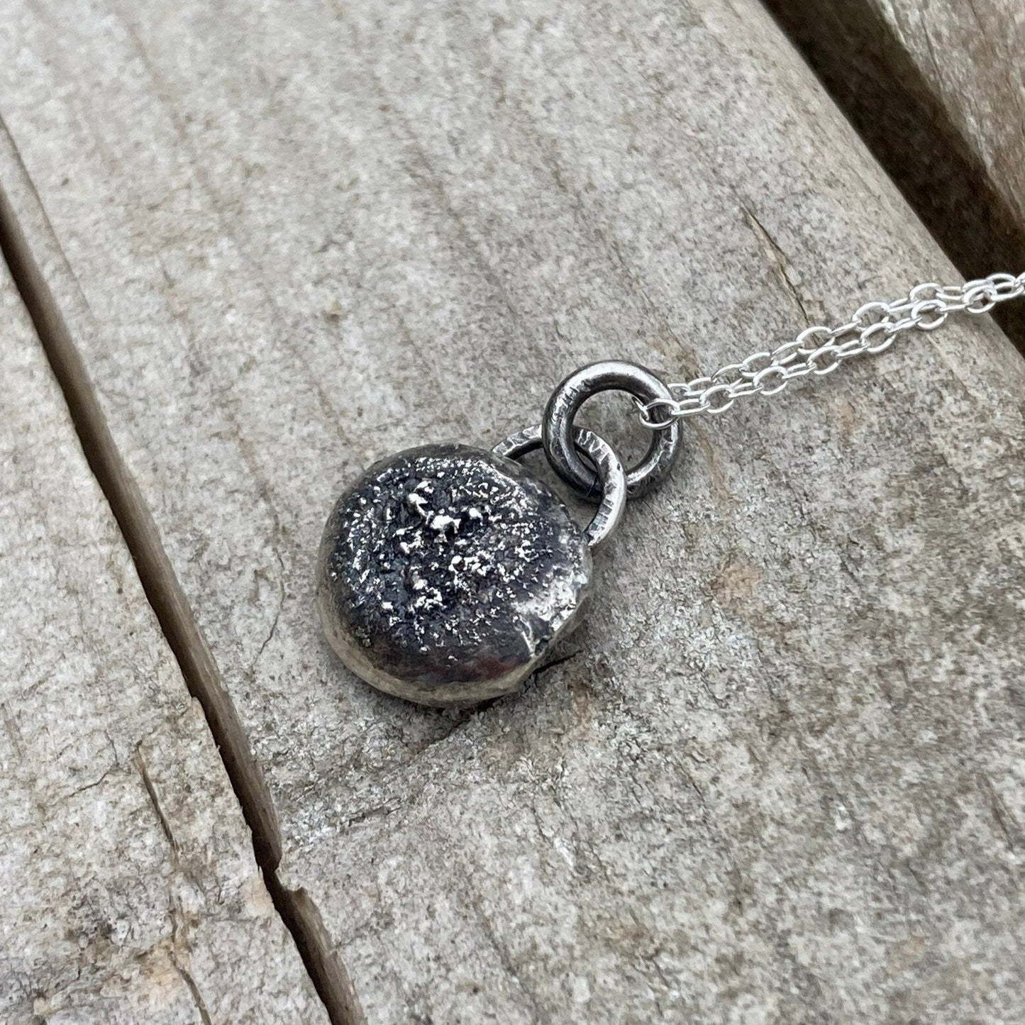Oxidised sterling silver pebble necklace.