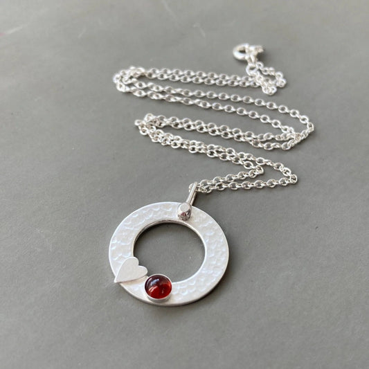 Sterling silver garnet circle necklace