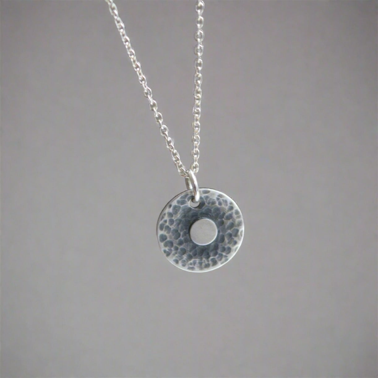 Hammered disc, sterling silver necklace.