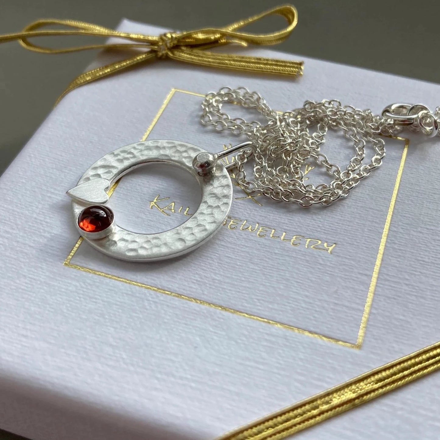 Sterling silver garnet circle necklace