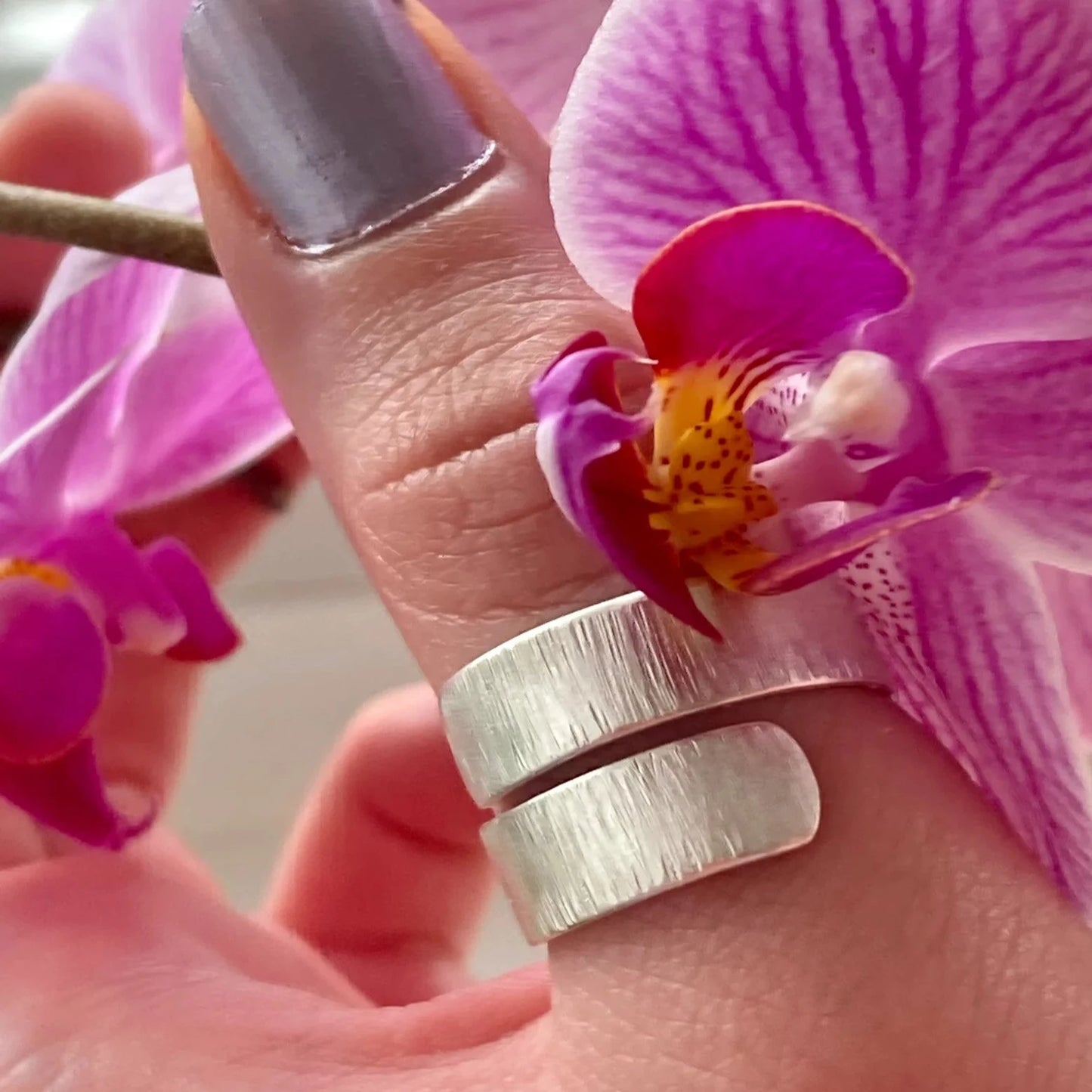 silver ring on finger