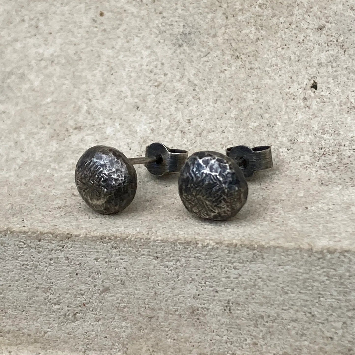Oxidised sterling silver pebble stud earrings.