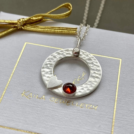Sterling silver garnet, heart, textured circle necklace