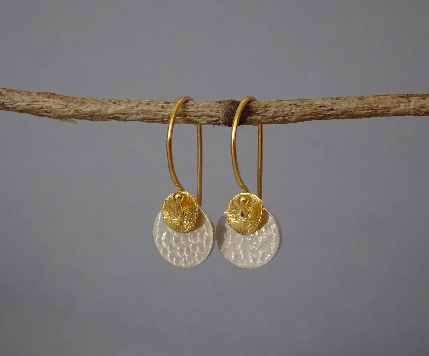 Sterling silver dangle earrings featuring a natural amethyst and a tassel