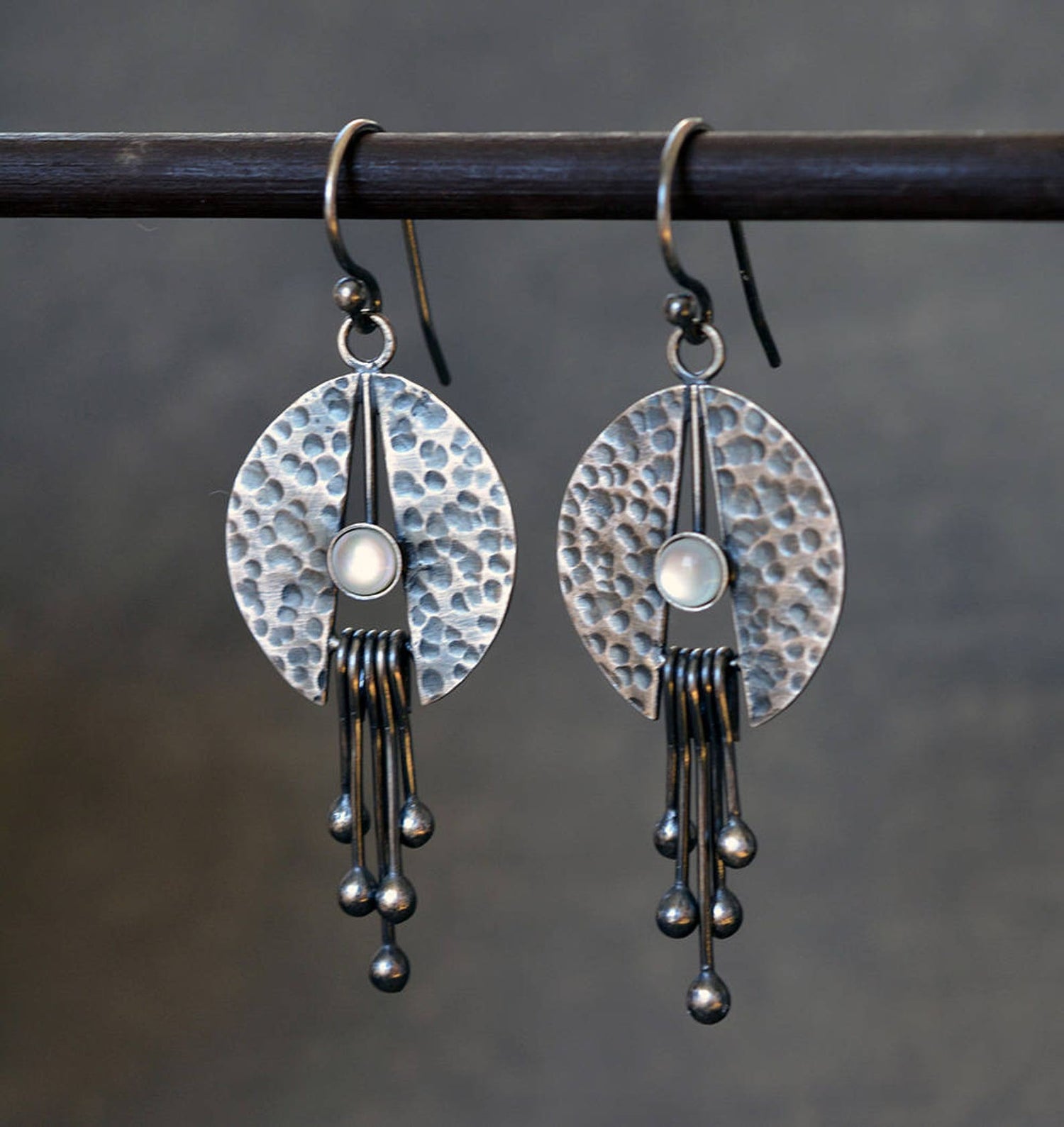 Handmade oxidised sterling silver dangle earrings featuring a natural mother of pearl