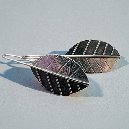 Sterling silver leaf earrings.