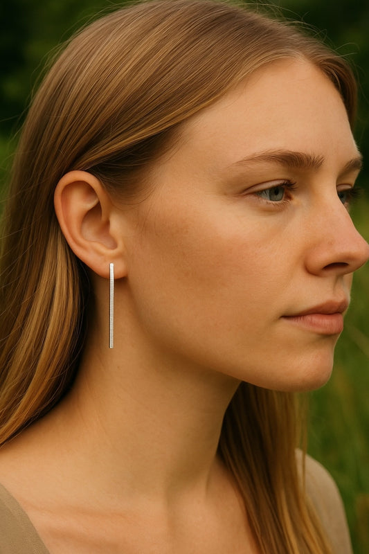 Hammered sterling silver bar stud earrings.