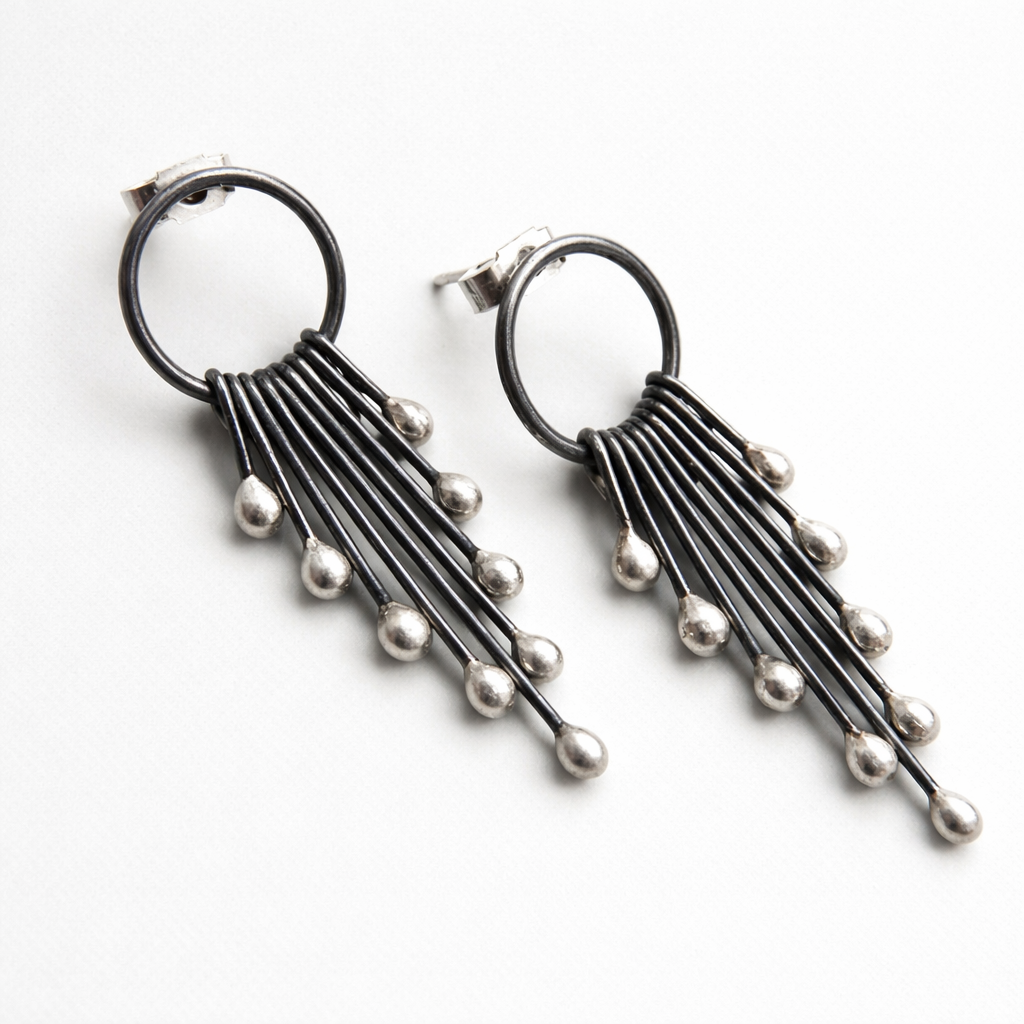 Sterling silver oxidised circle and droplets stud earrings.