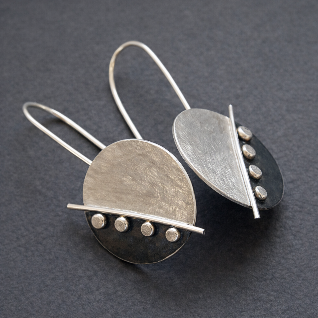 Large sterling silver disc earrings.