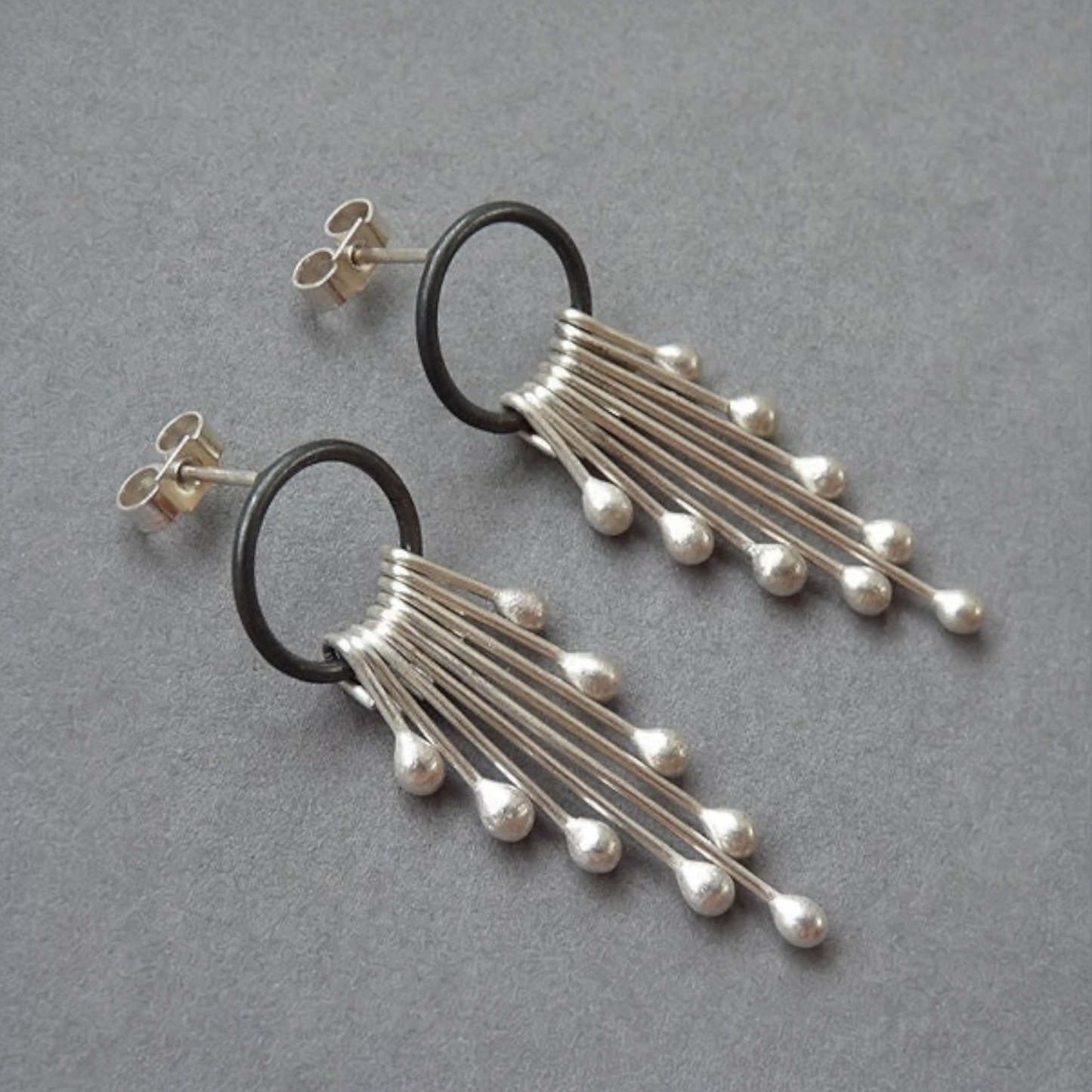 Sterling silver dangle earrings.