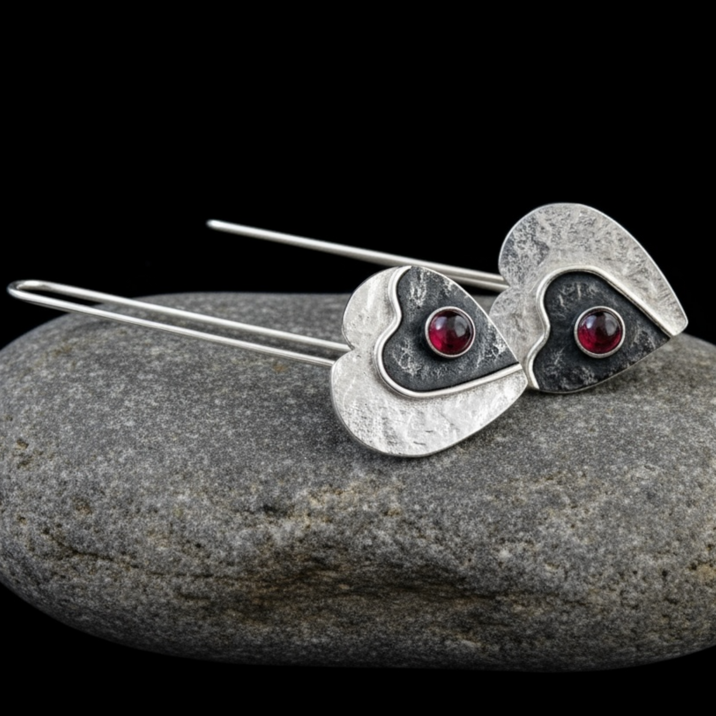 Garnet sterling silver heart earrings.