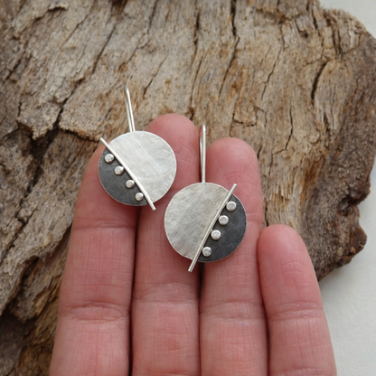 Large sterling silver disc earrings.