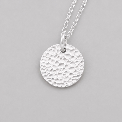 Minimalist sterling silver textured disc necklace.