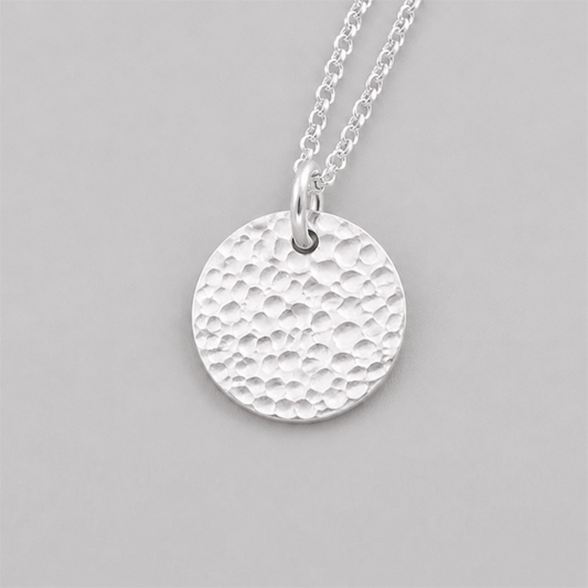 Minimalist sterling silver textured disc necklace.