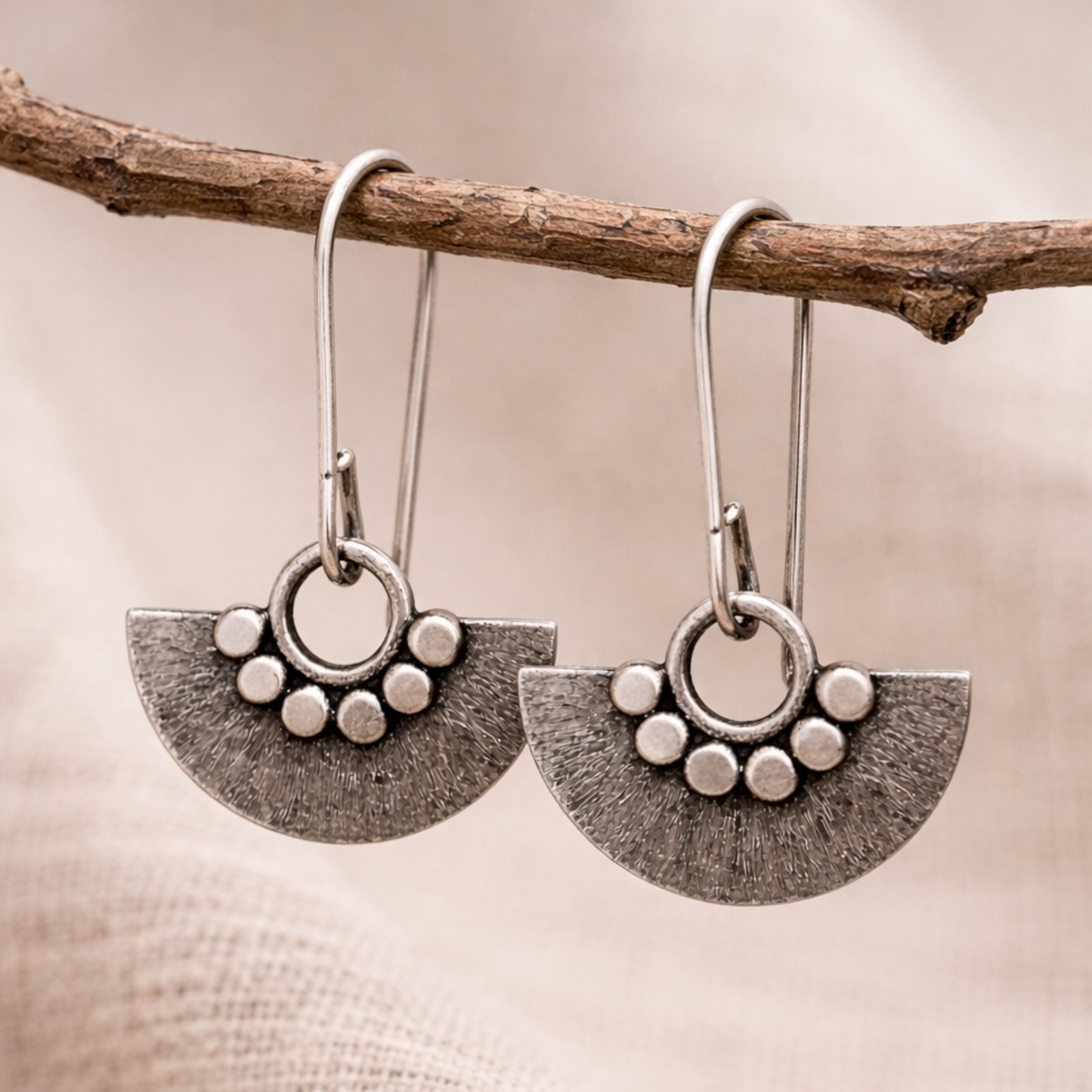 Sterling silver dangle fan earrings.