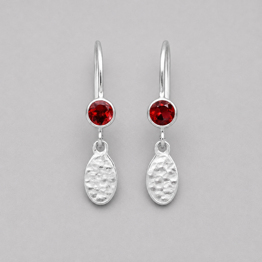 Garnet birthstone sterling silver dangle textured oval earrings.