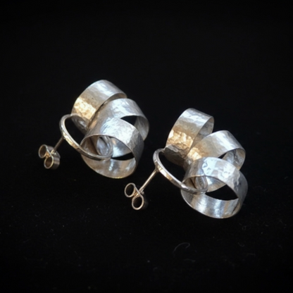 Sterling silver circle stud earrings.